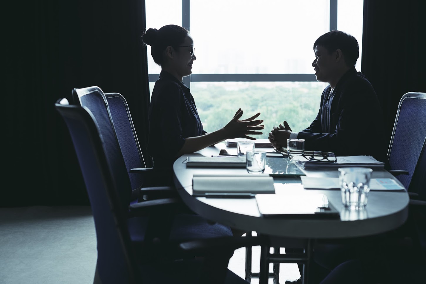 Staffing employees reviewing work opportunities together