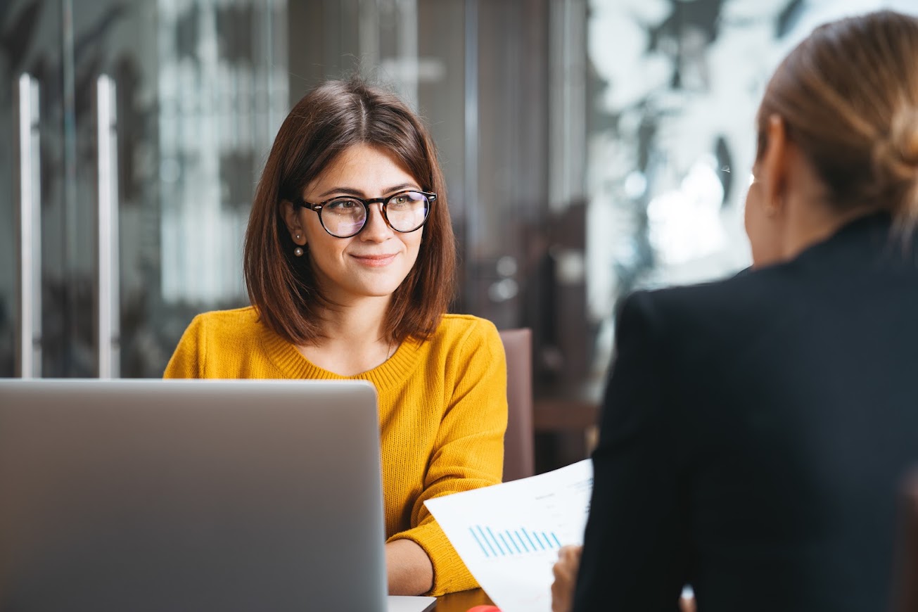 Team members collaborating in an office meeting
