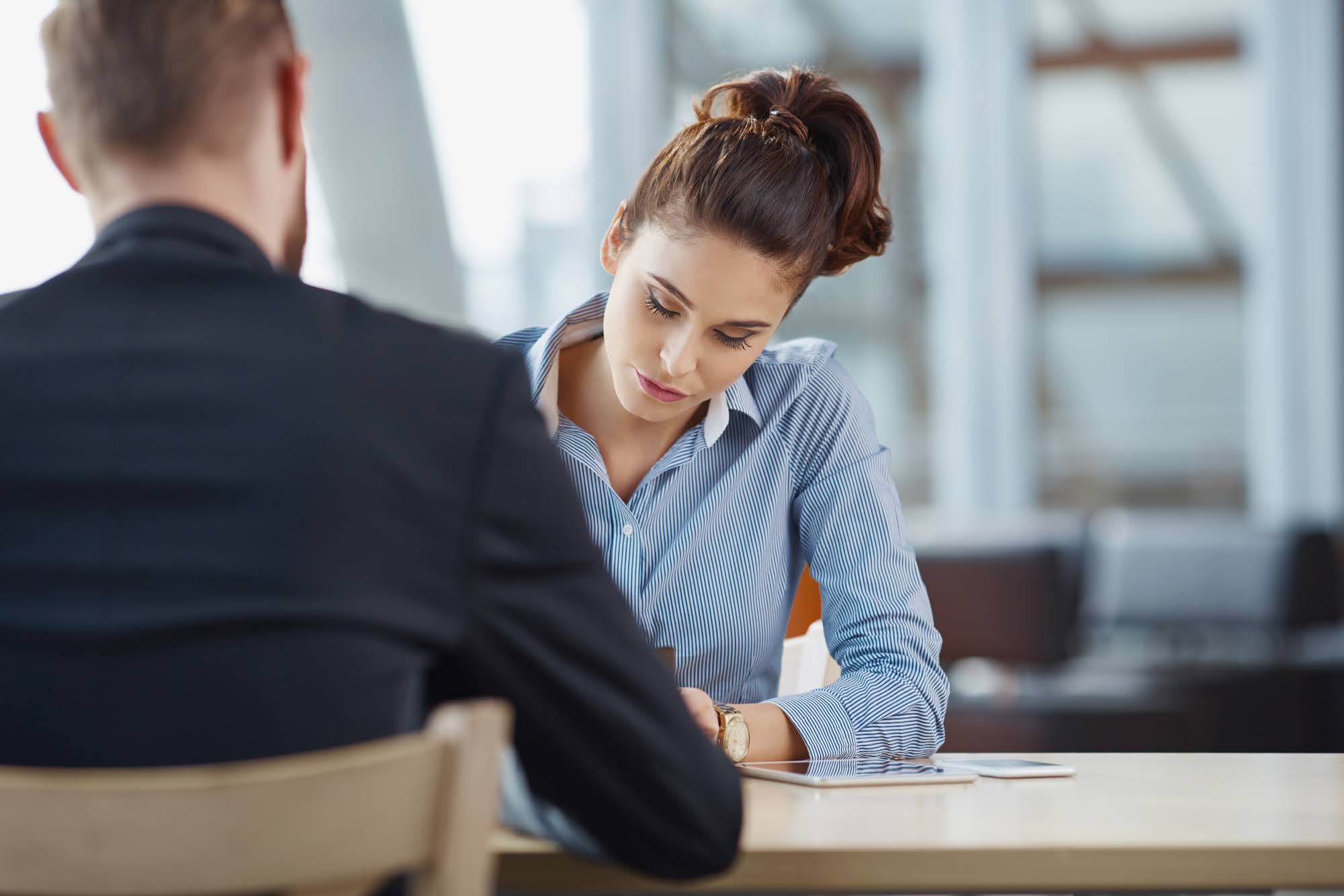 Job seeker reviewing paperwork while finding work