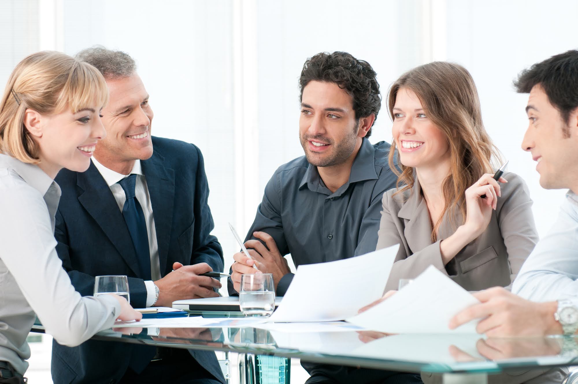 Multigenerational team meeting around a conference table